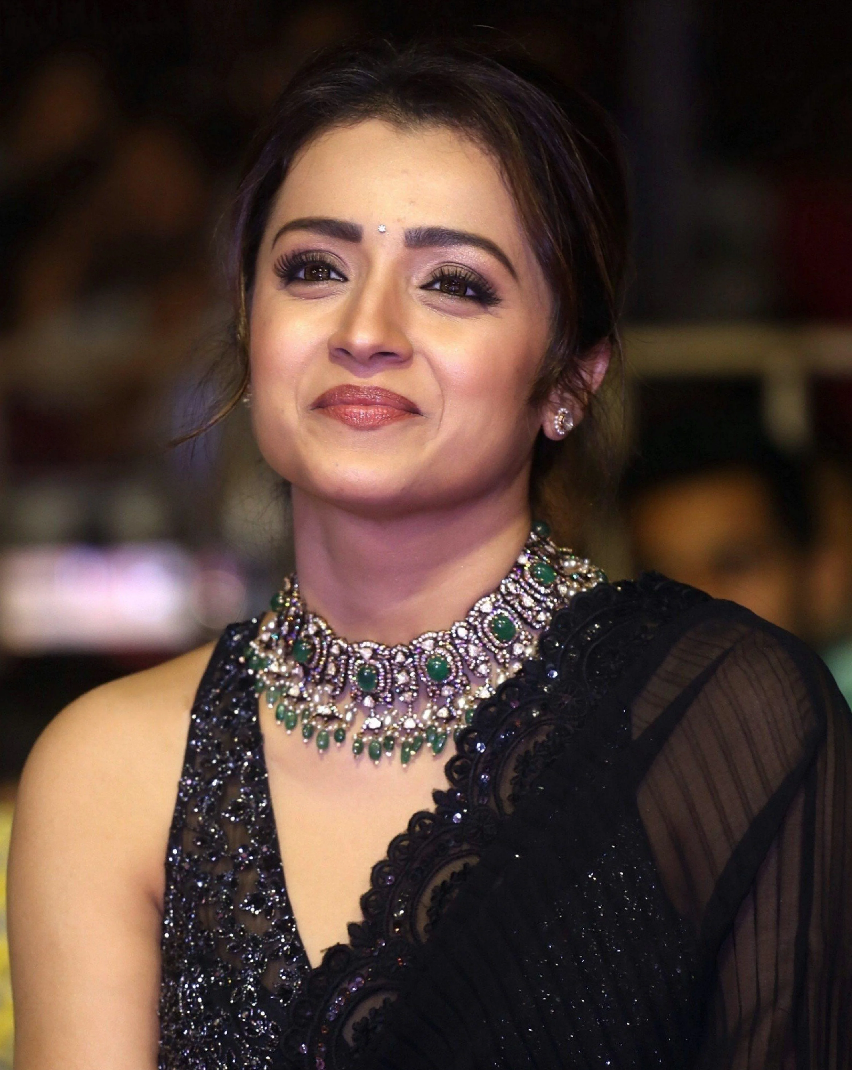 Close-up HD image of Trisha Krishnan with elegant makeup, re