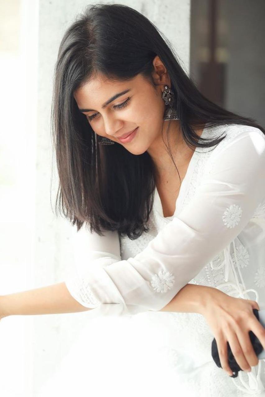 Calm Kalyani in White Outfit Looking Down Gently Photo