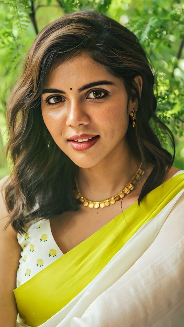 Closeup of Priyadarshan in White and Yellow Saree Image