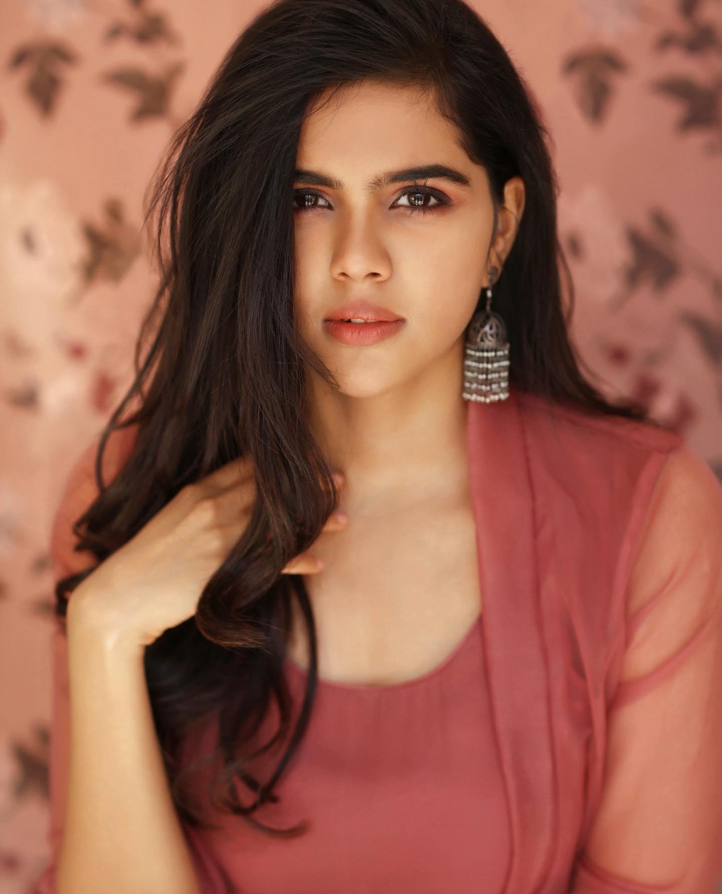 Confident Priyadarshan in Maroon Dress Studio Photography