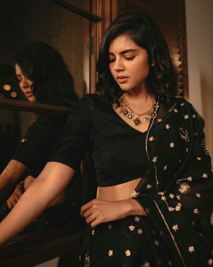 Elegant Kalyani in Black Embroidered Saree Indoors Wallpaper