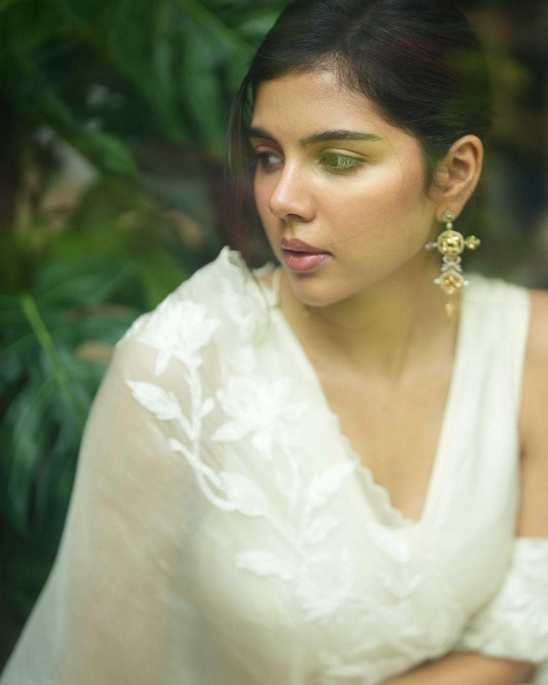 Elegant Kalyani in White Saree with Earrings free Image