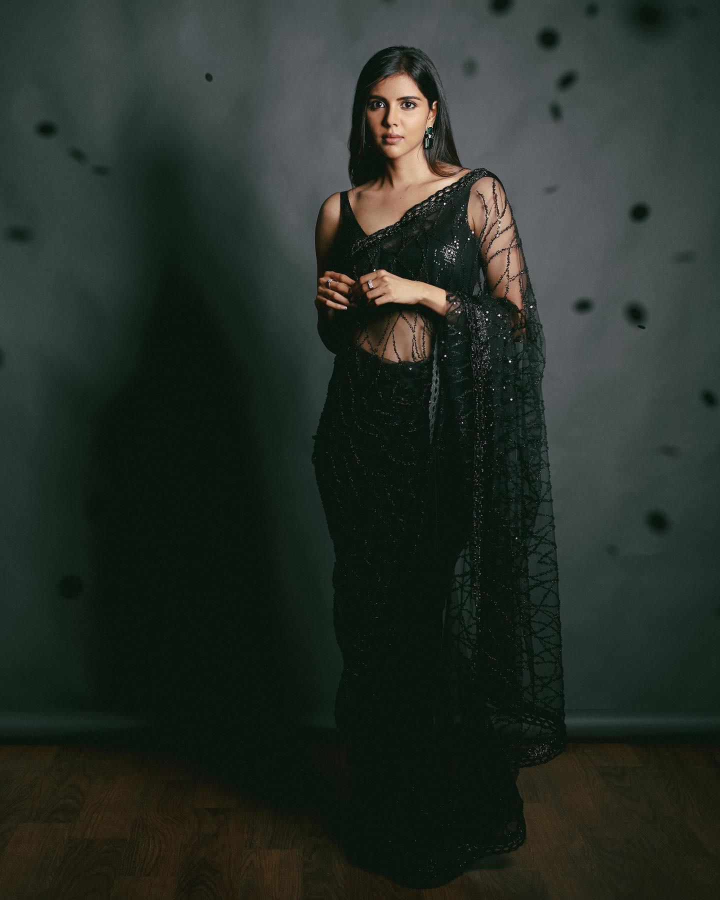 Elegant Priyadarshan in Black Saree Posing Indoors Image