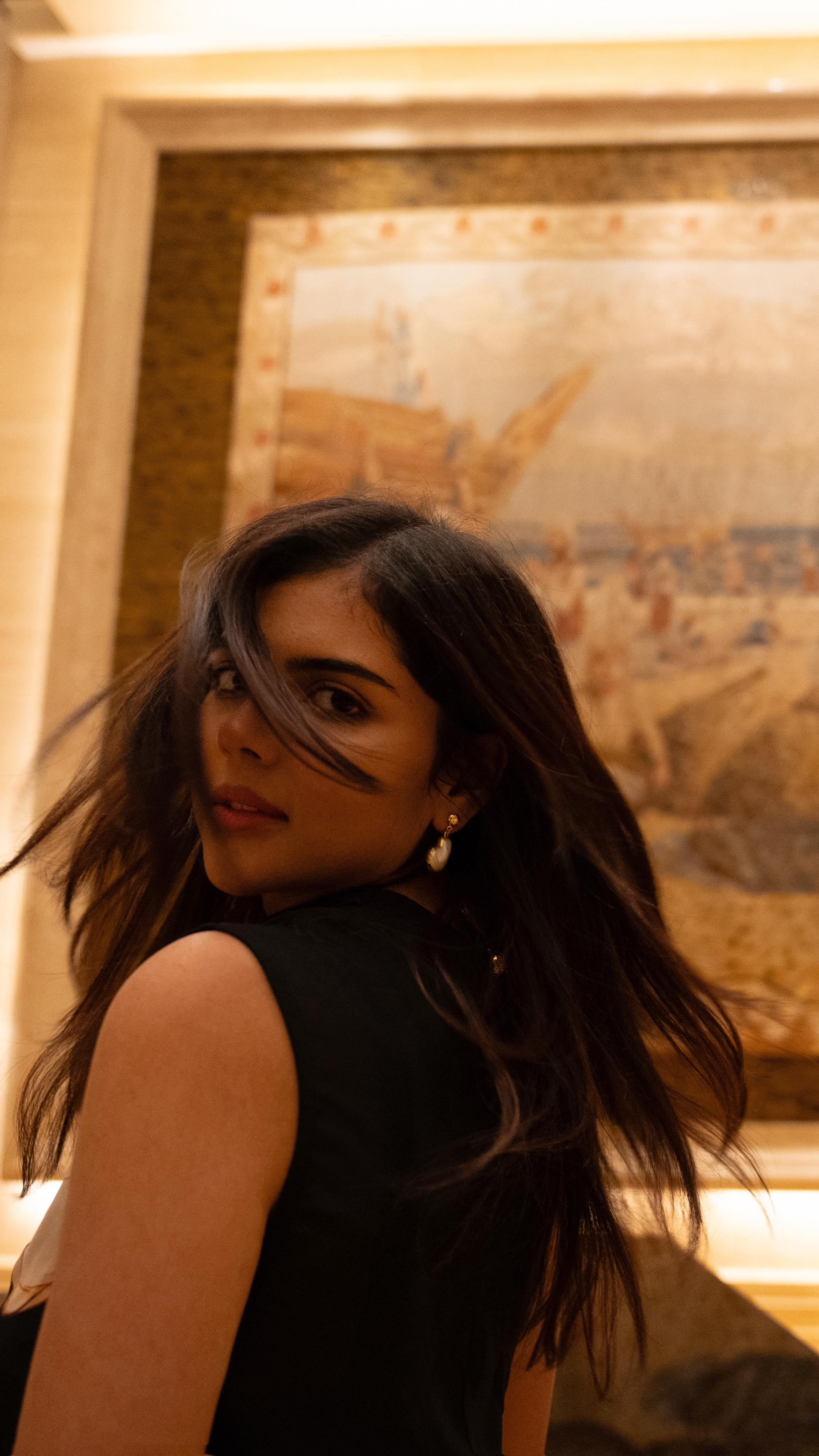 Flying Hair Look of Kalyani Priyadarshan in Black Dress Pic