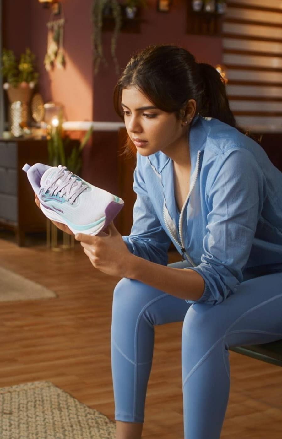 Focused Priyadarshan in Blue Outfit Reading Papers Image
