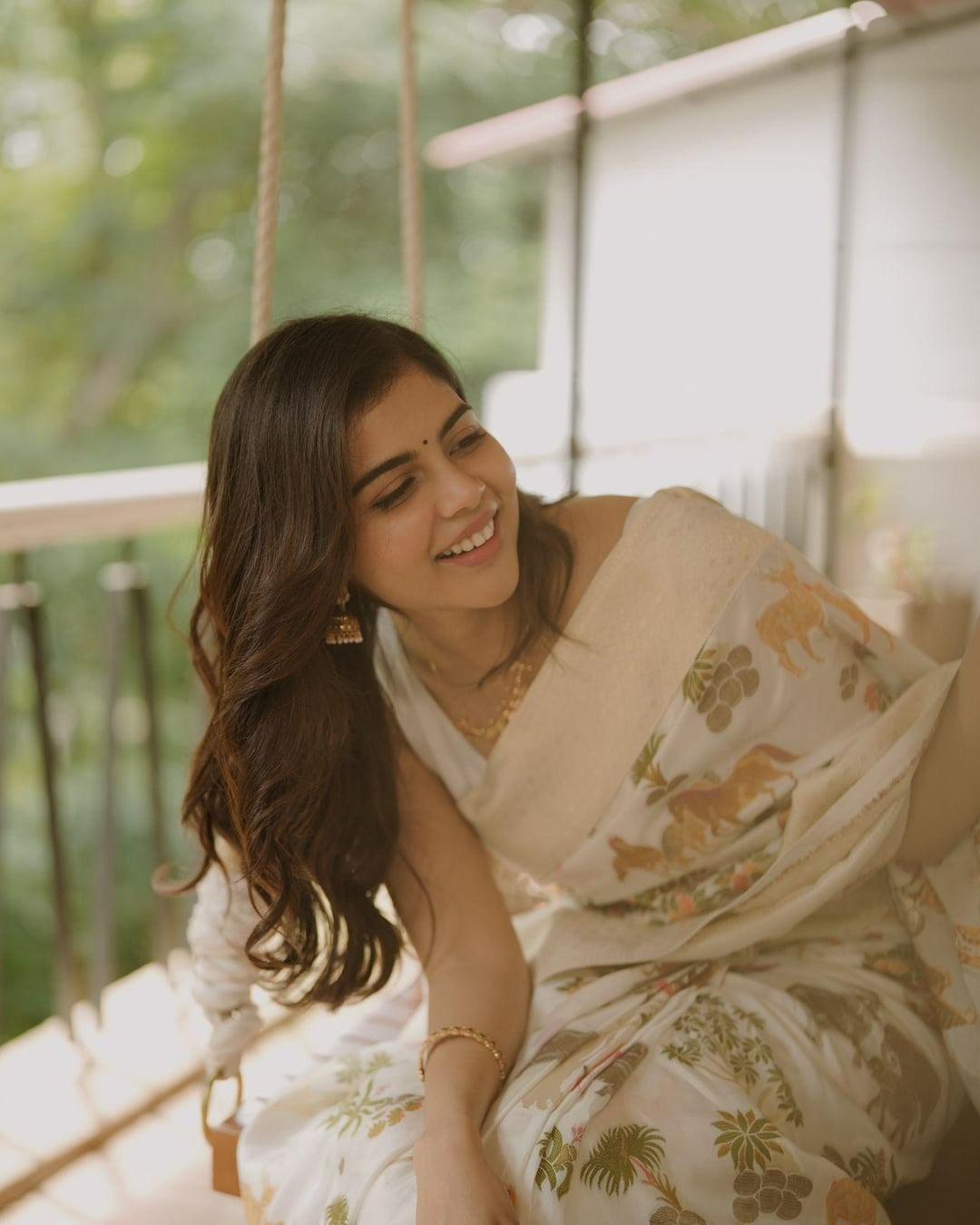 Happy Kalyani Priyadarshan on Swing in Floral Saree Image