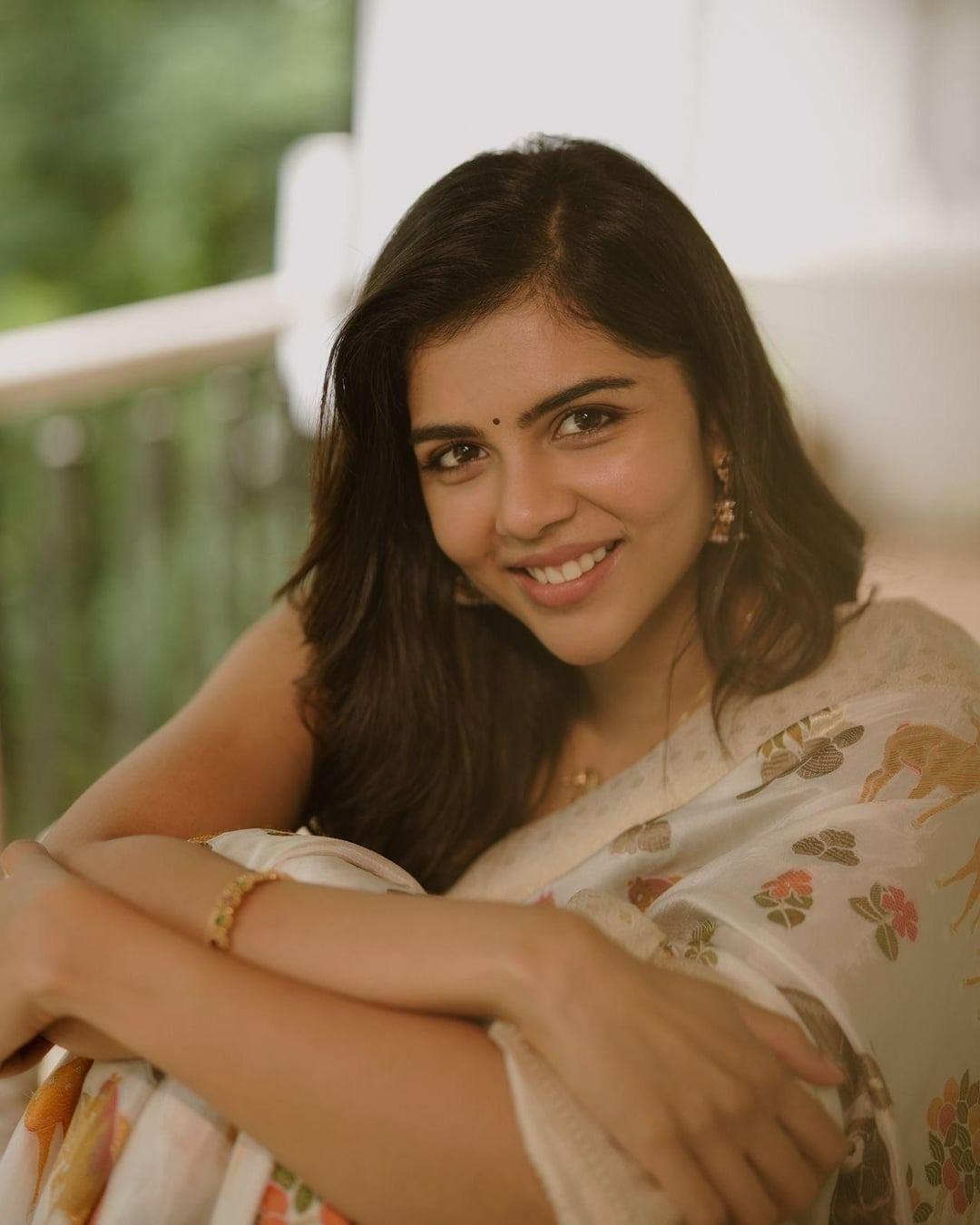Happy Kalyani Sitting in Cream Saree with Floral Design Pic