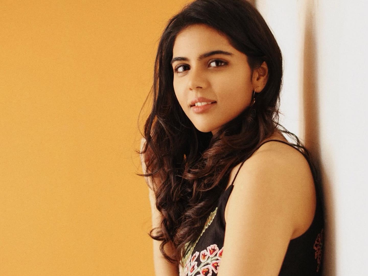 Kalyani in Black Dress with Orange Wall Background Pic