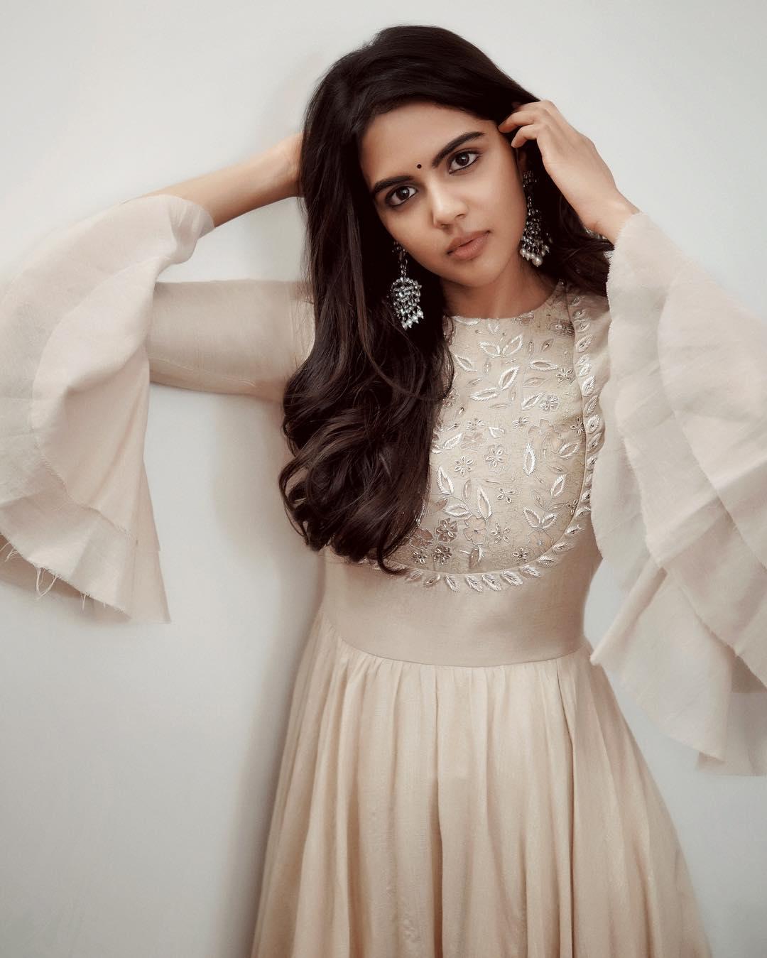 Kalyani in Cream Gown with Long Sleeves Posing free Image