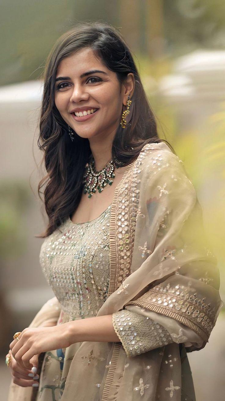 Kalyani in Golden Outfit with Joyful Smile free HD Photo