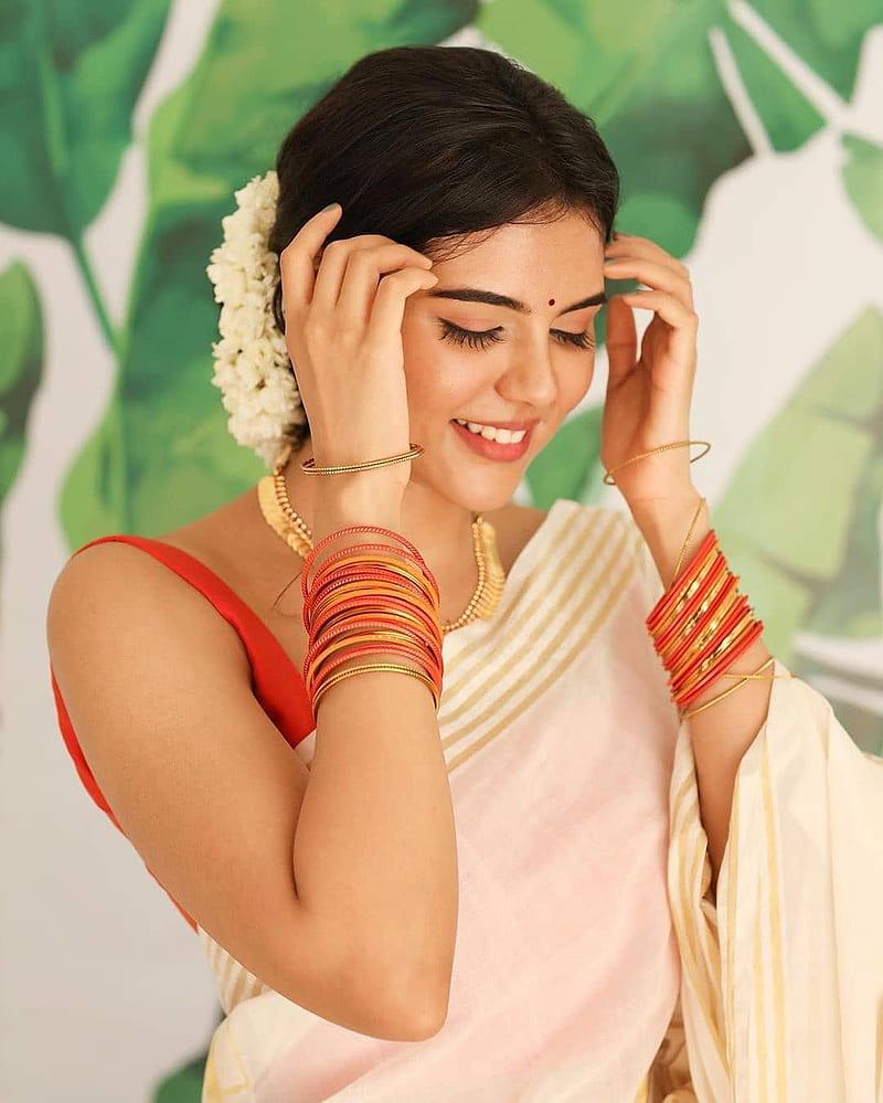 Kalyani in White Saree Adjusting Jasmine Flowers Image