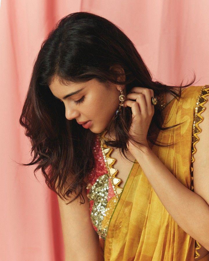 Kalyani in Yellow Saree Looking Down with Grace Image