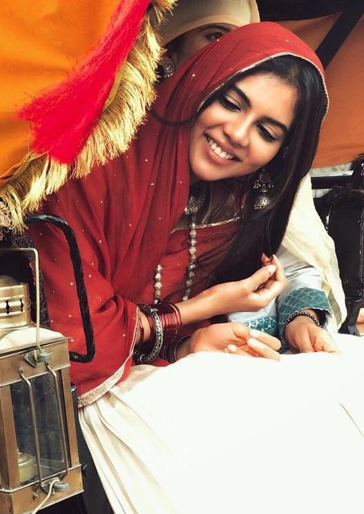 Kalyani Laughing in Red Dupatta Festive Moment Image