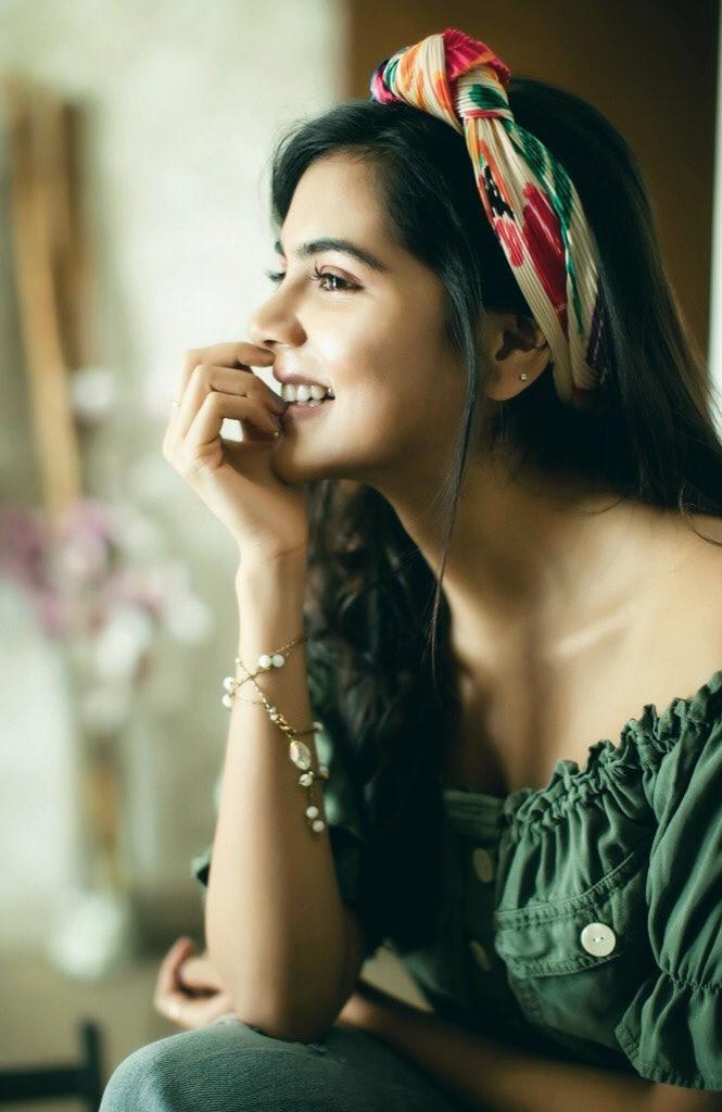 Kalyani Laughing with Headband and Green Dress Photo