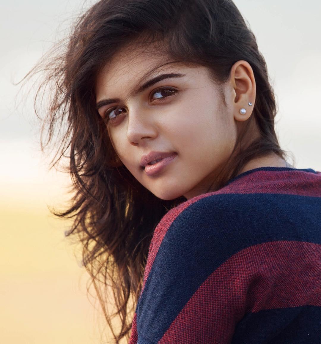 Kalyani Looking Back Wearing Striped Sweater Outdoor Image