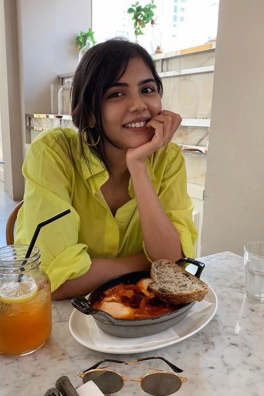 Kalyani Priyadarshan Eating Bread and Drinking Juice Image