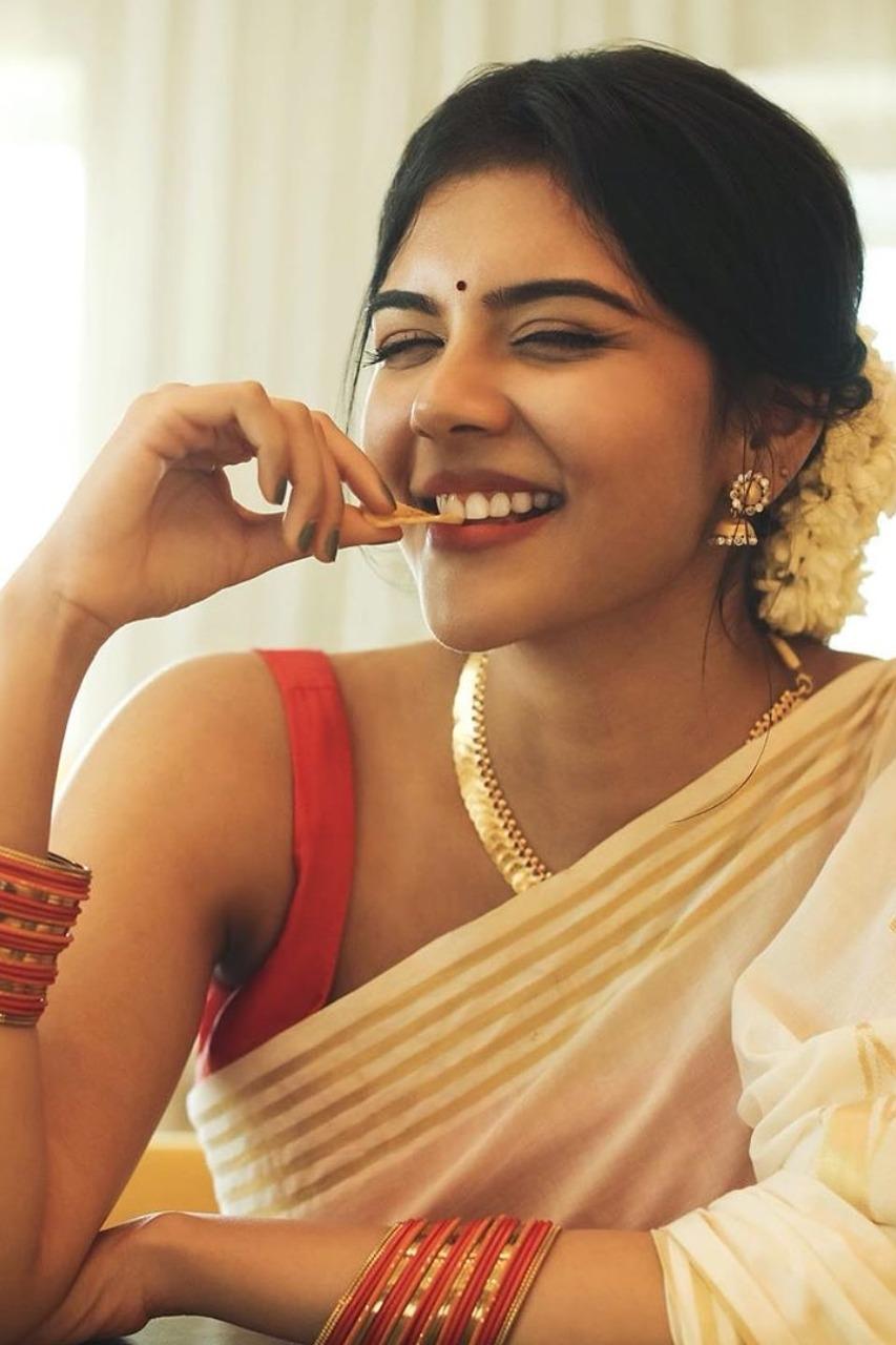 Kalyani Priyadarshan Eating with Cute Expression Photo
