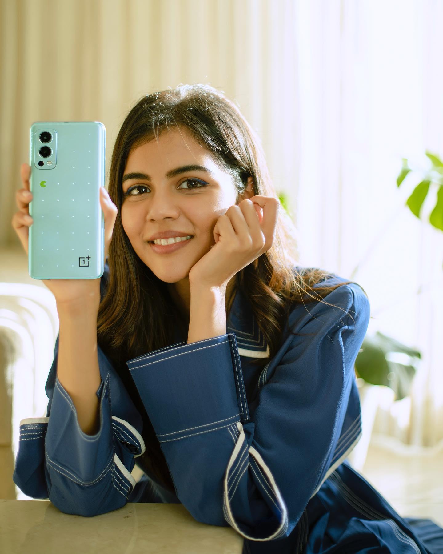 Kalyani Priyadarshan Holding Mobile in Blue Color Photo