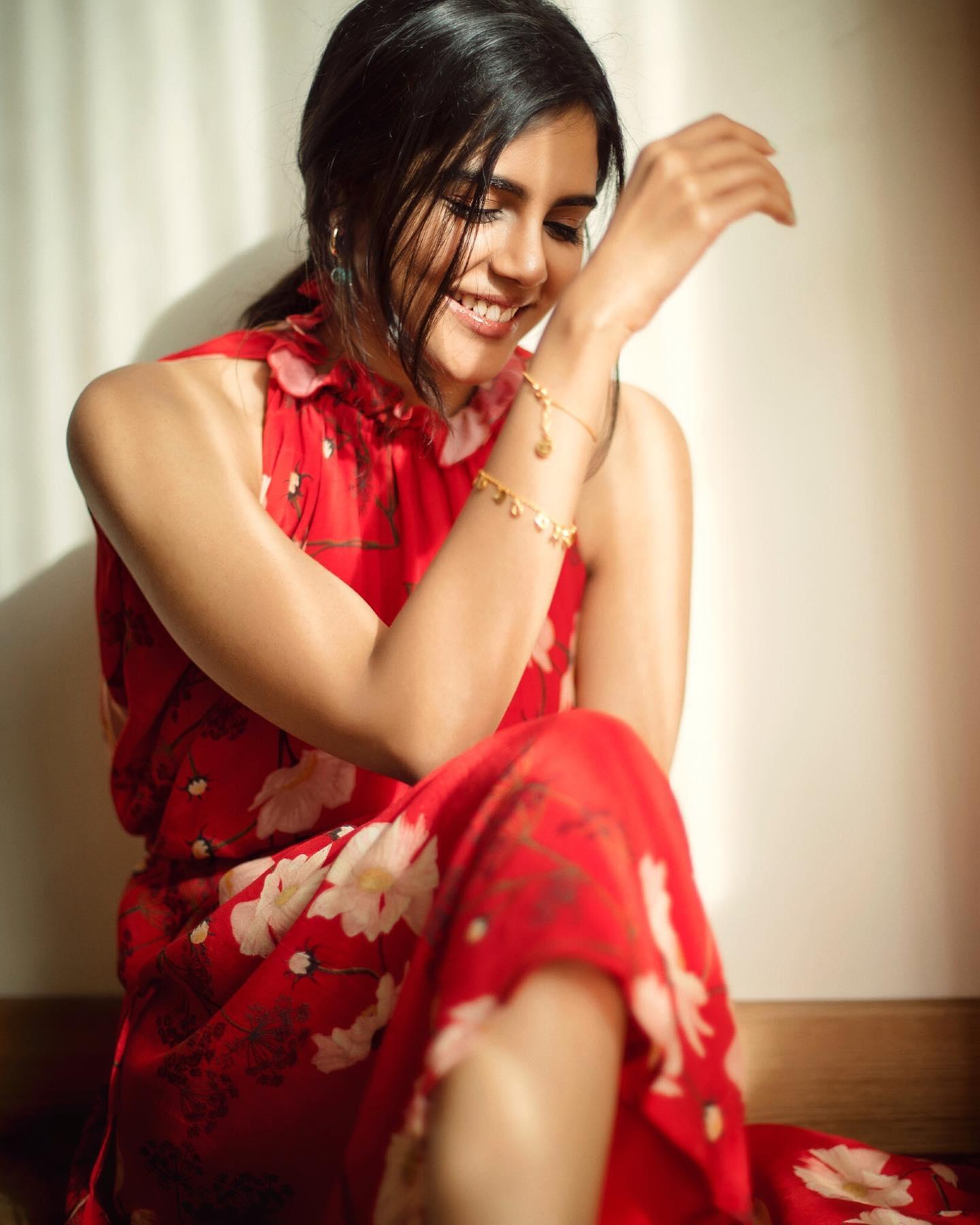 Kalyani Priyadarshan in a Red Dress Smiling Quality Image