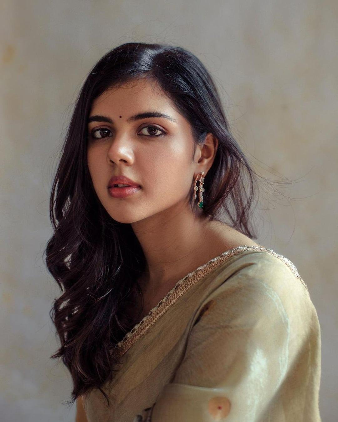 Kalyani Priyadarshan in a Yellow Saree Smiling Photo
