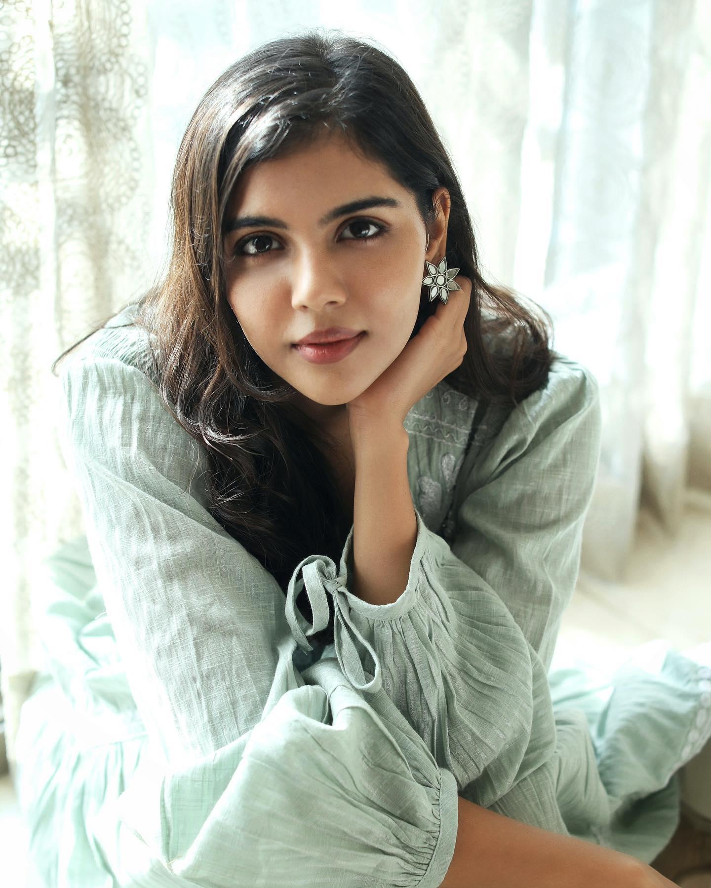 Kalyani Priyadarshan in Blue Dress with Cute Pose Wallpaper