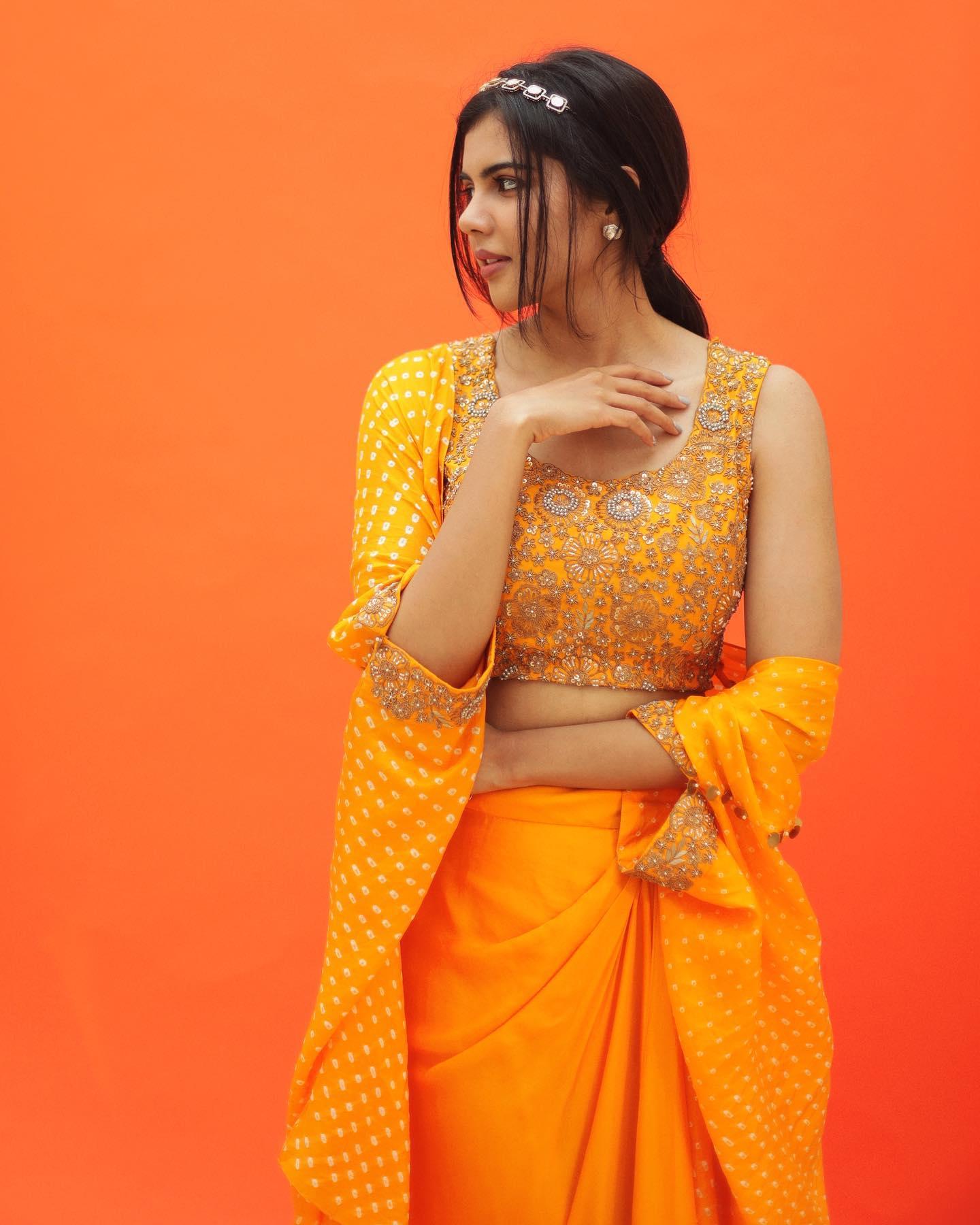 Kalyani Priyadarshan in Orange Dress free 4K Backdrop