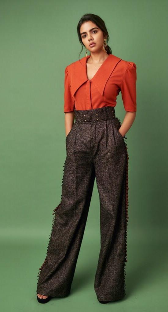 Kalyani Priyadarshan in Orange Top Fashion Pose Image