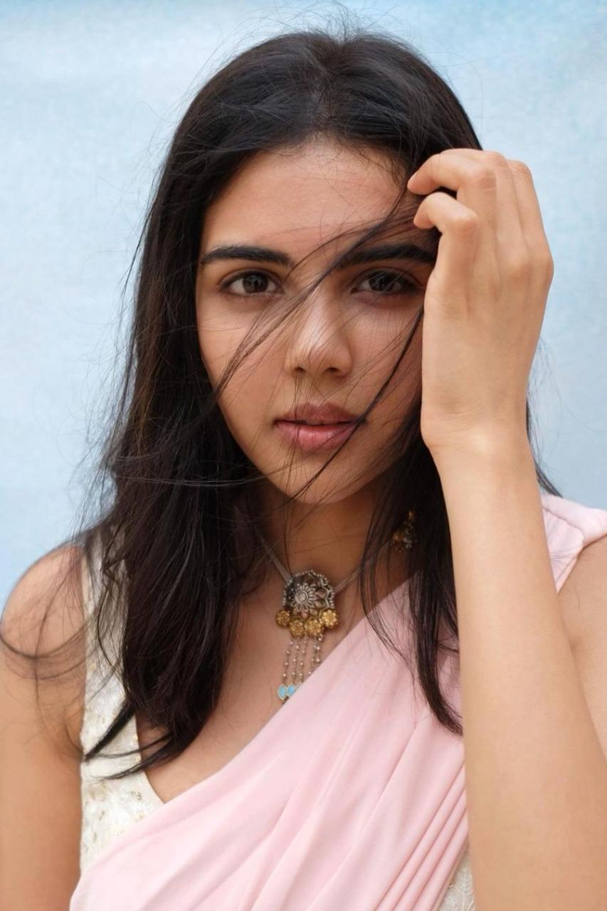 Kalyani Priyadarshan in Pink Saree with Blue Backdrop