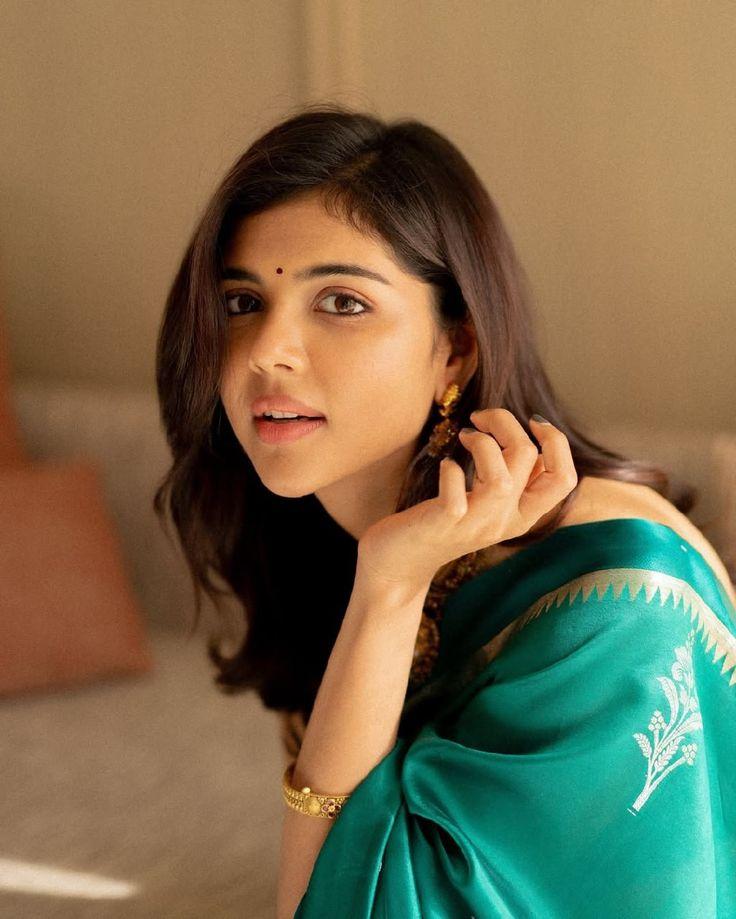 Kalyani Priyadarshan in Teal Saree Side Glance Image