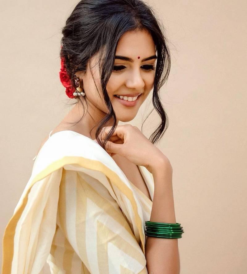 Kalyani Priyadarshan in White Saree Smiling free Image