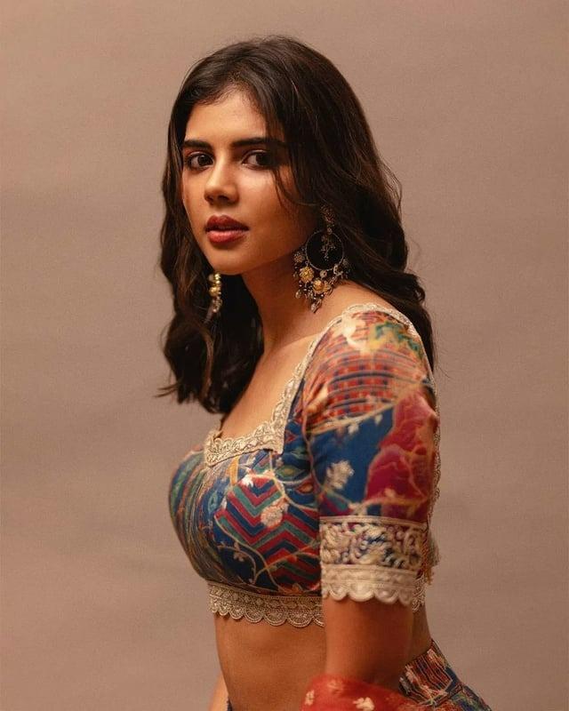Kalyani Priyadarshan Side Pose in Flared Yellow Gown Pic