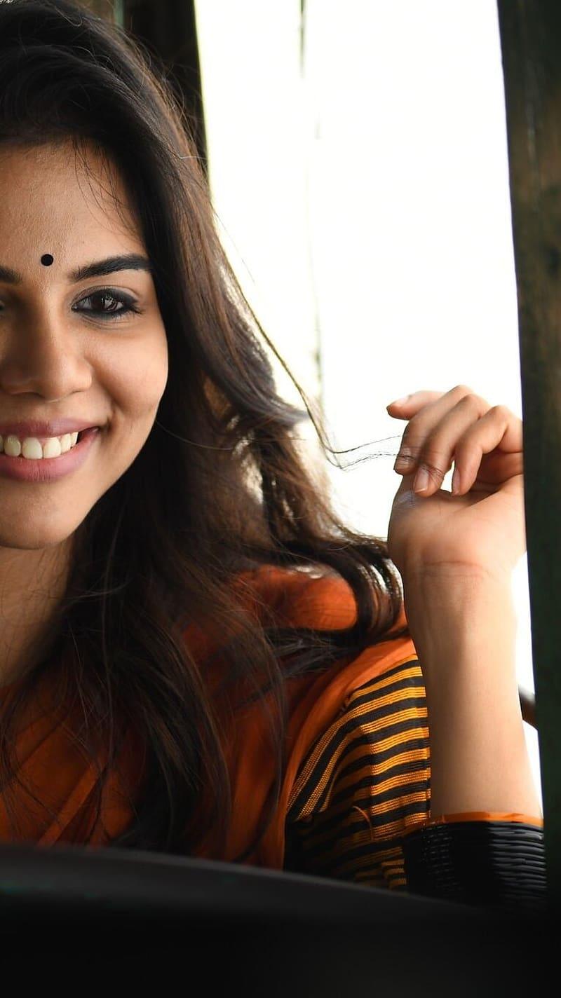 Kalyani Priyadarshan Smiling in Orange Saree Car HD Shot