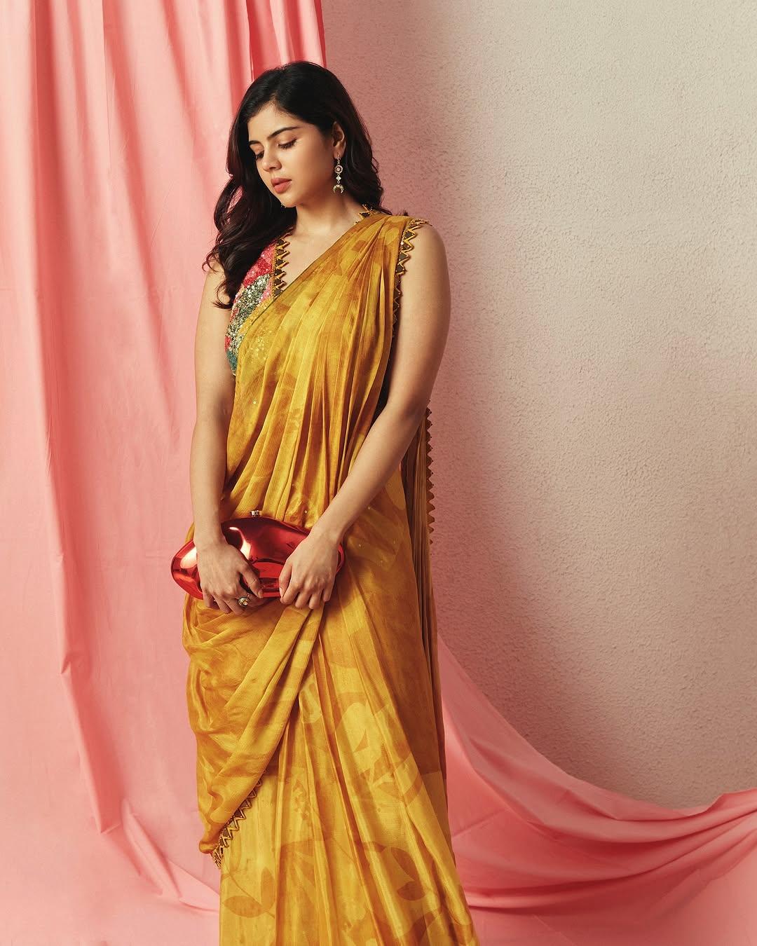 Kalyani Priyadarshan Stuns in Vibrant Mustard Saree Wallpaper