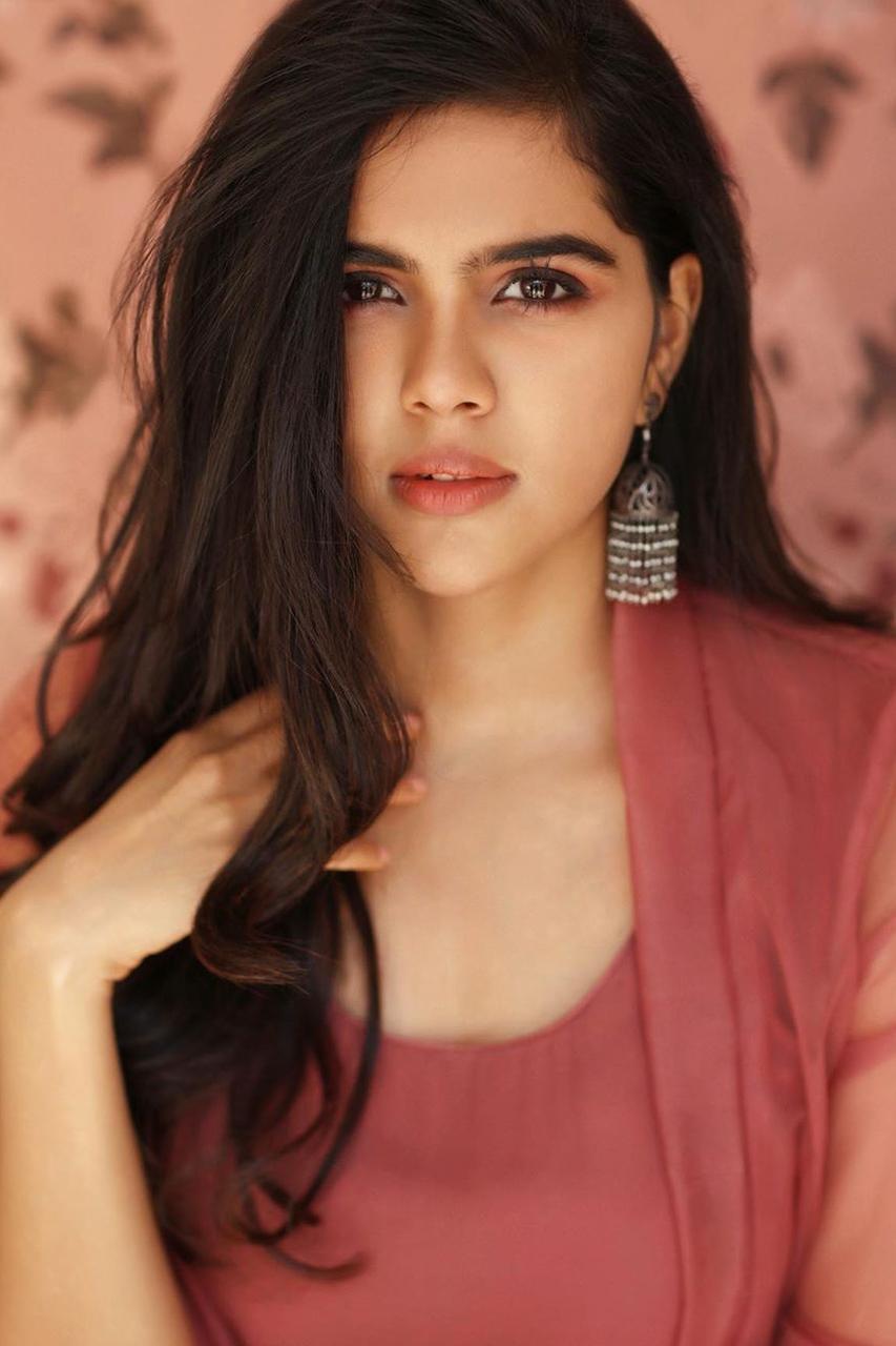 Kalyani Priyadarshan Wearing a Peach Colored Dress Image