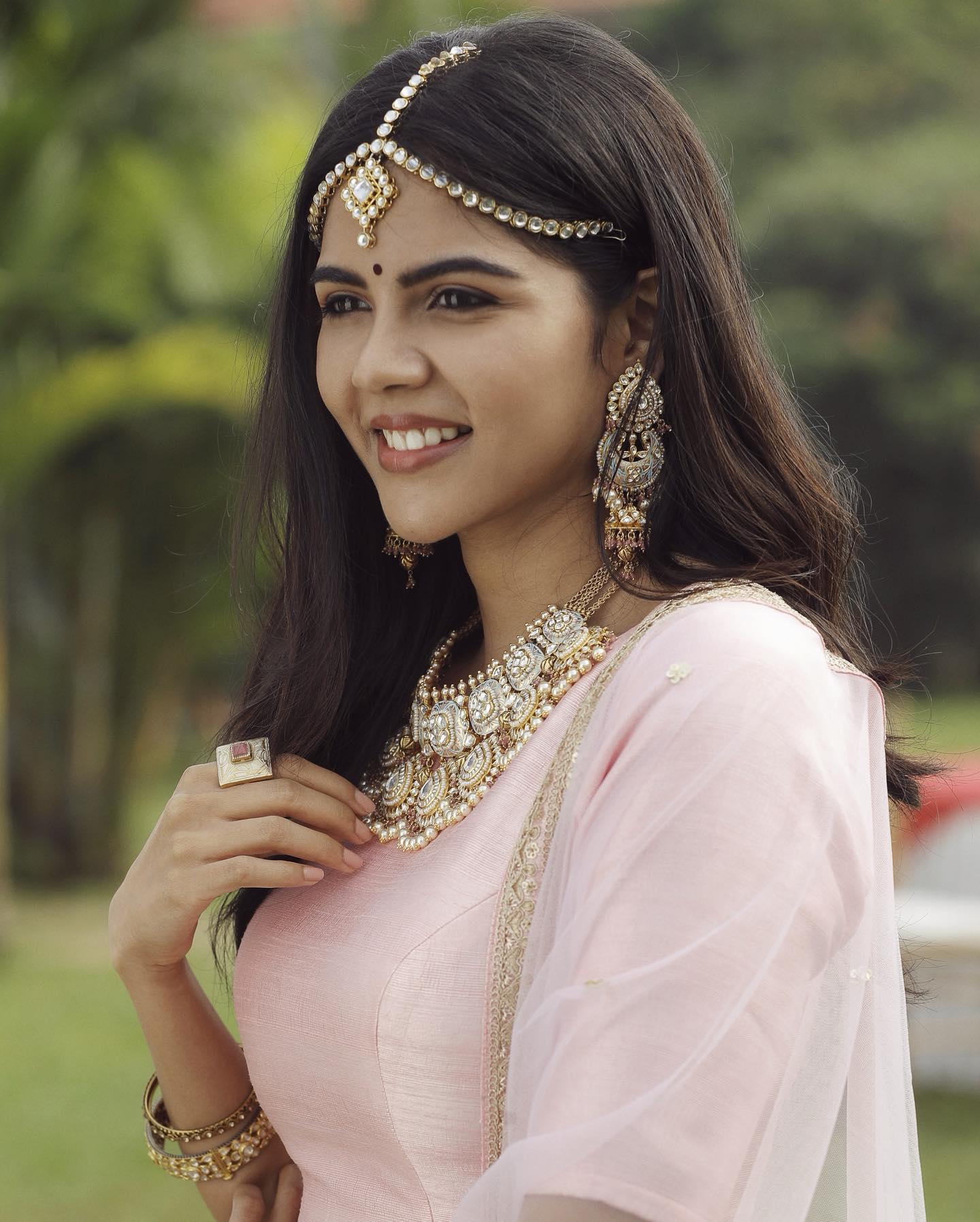 Kalyani Priyadarshan Wearing Jewelry and Smiling Face HD