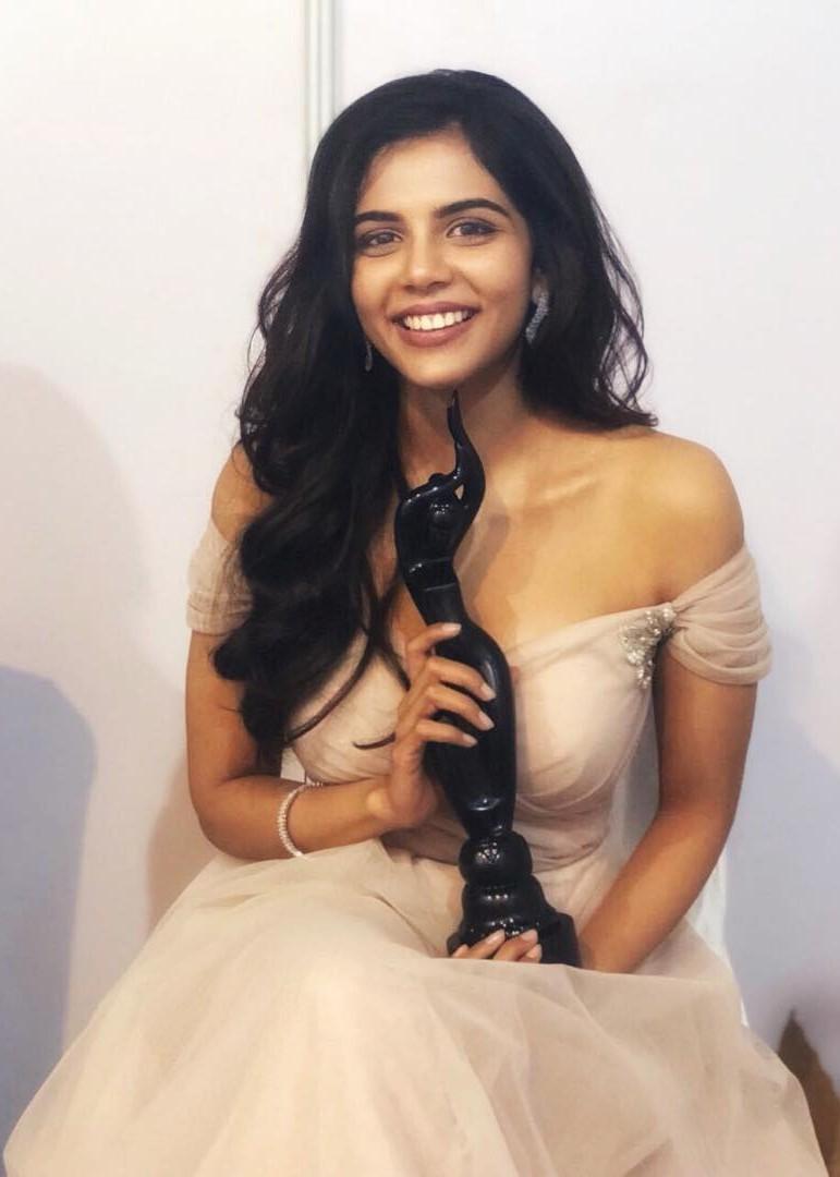 Kalyani Smiling in Off Shoulder Gown Holding Award Image