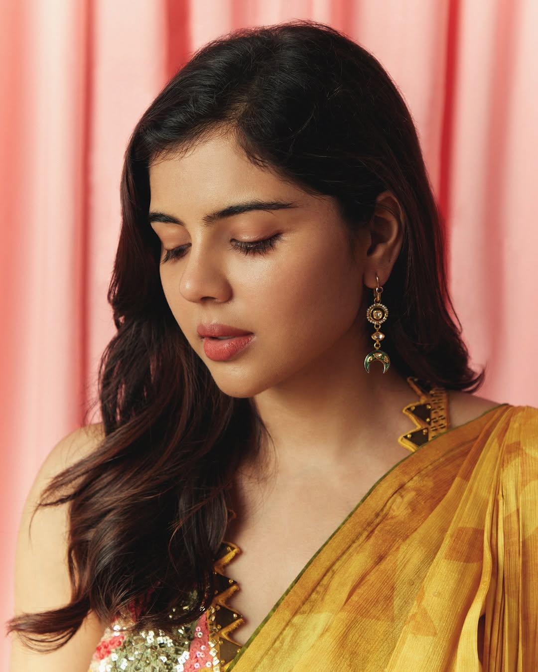 Pensive Priyadarshan in Golden Saree Closeup Photo