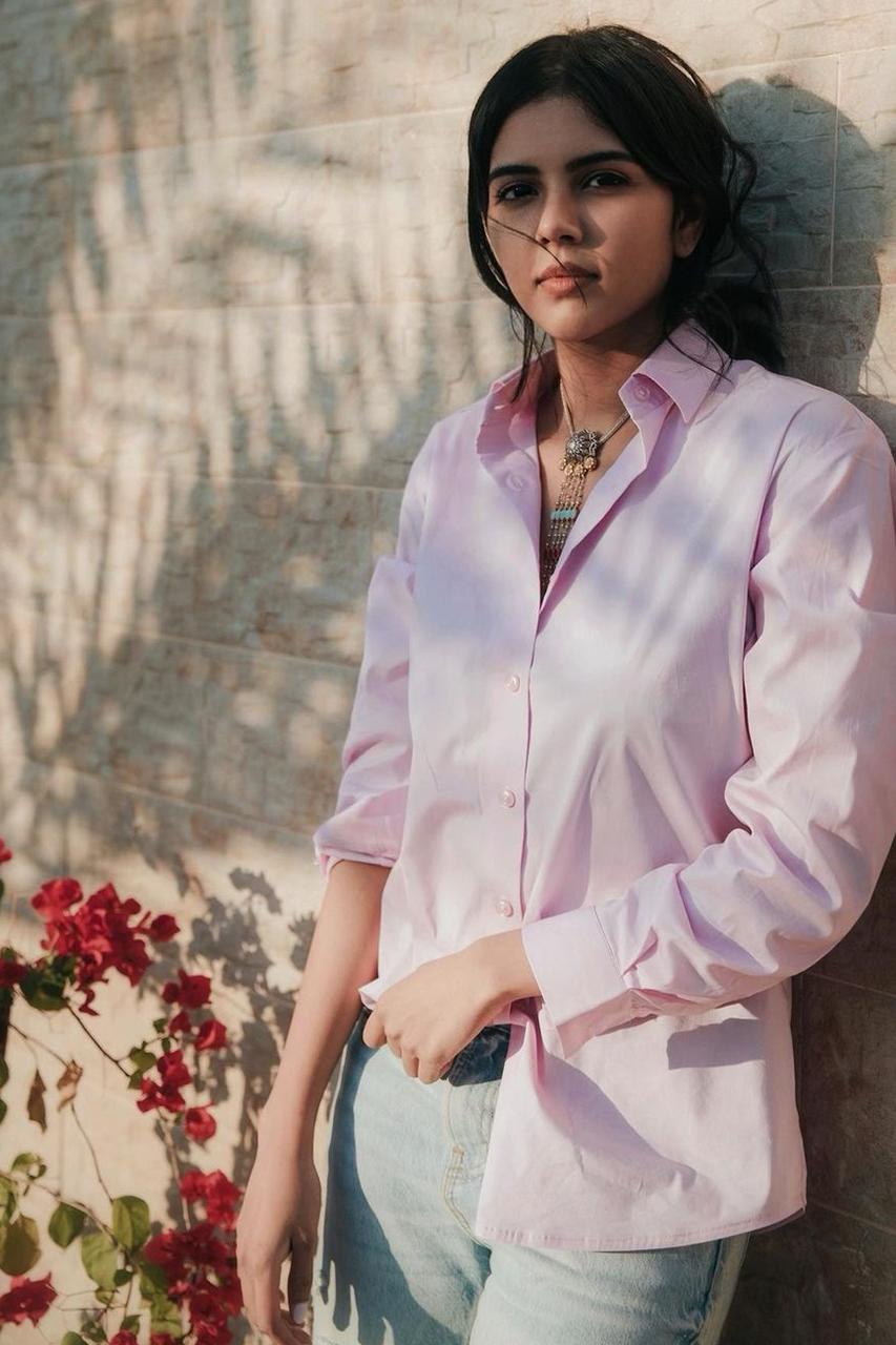 Pink Shirt Image of Kalyani Priyadarshan with Flowers