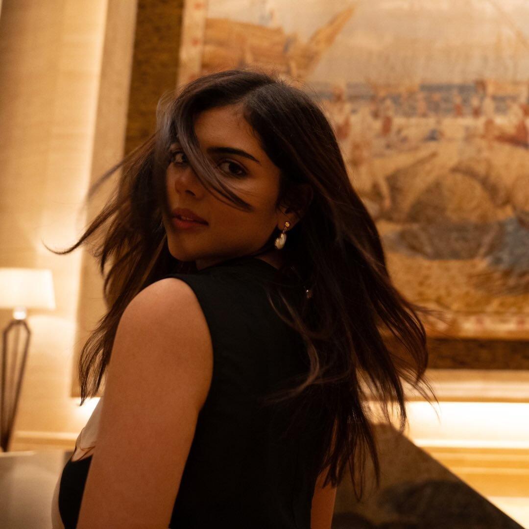 Priyadarshan in Black Dress Looking Back Indoors Image