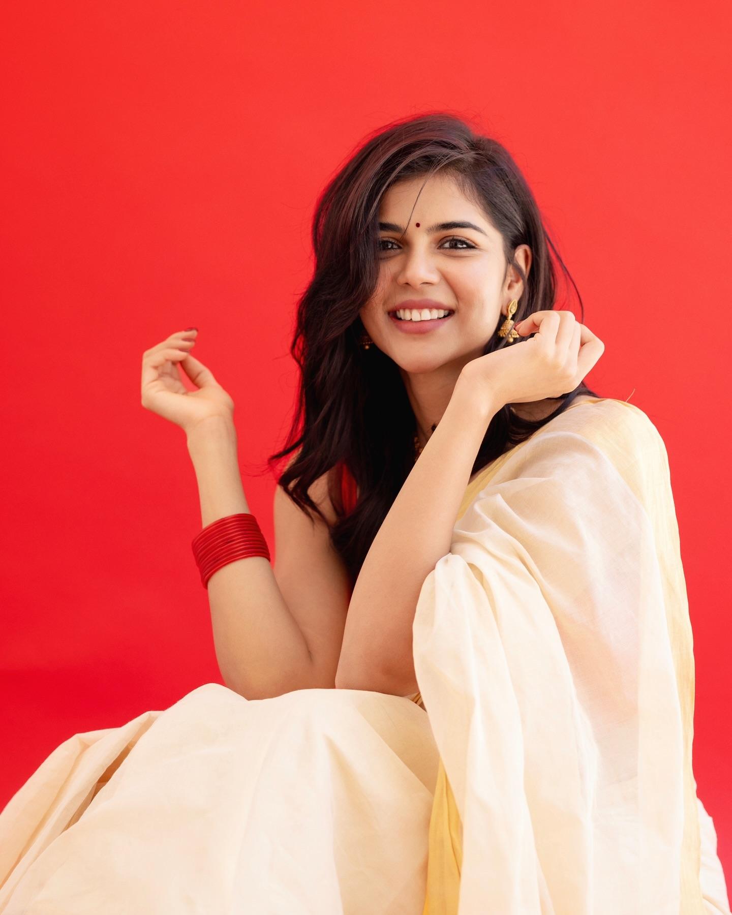 Priyadarshan in Traditional Wear with Red Background 4K