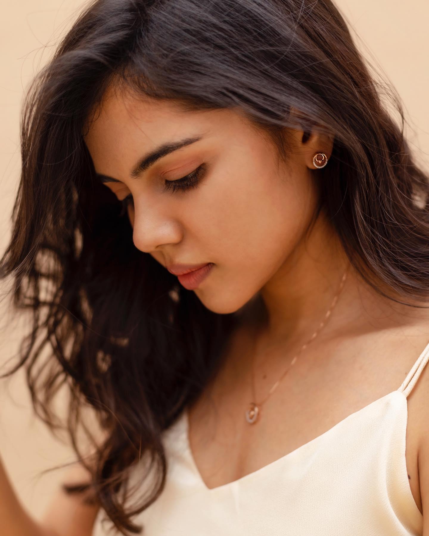 Priyadarshan in White Dress with Pink Earrings Photo
