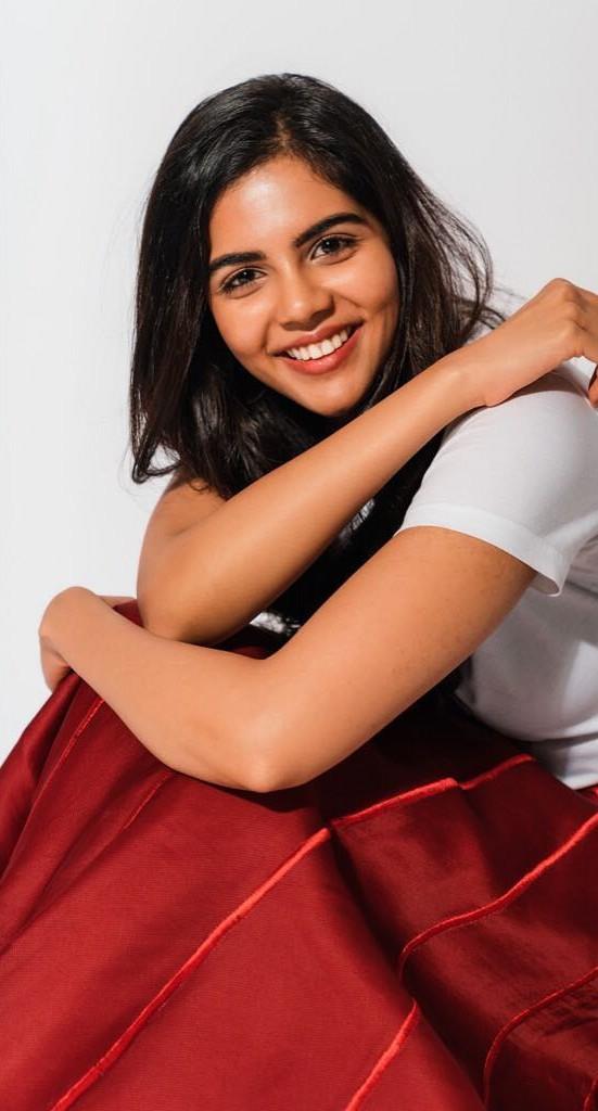 Priyadarshan in White Top Smiling with Red Skirt Photography