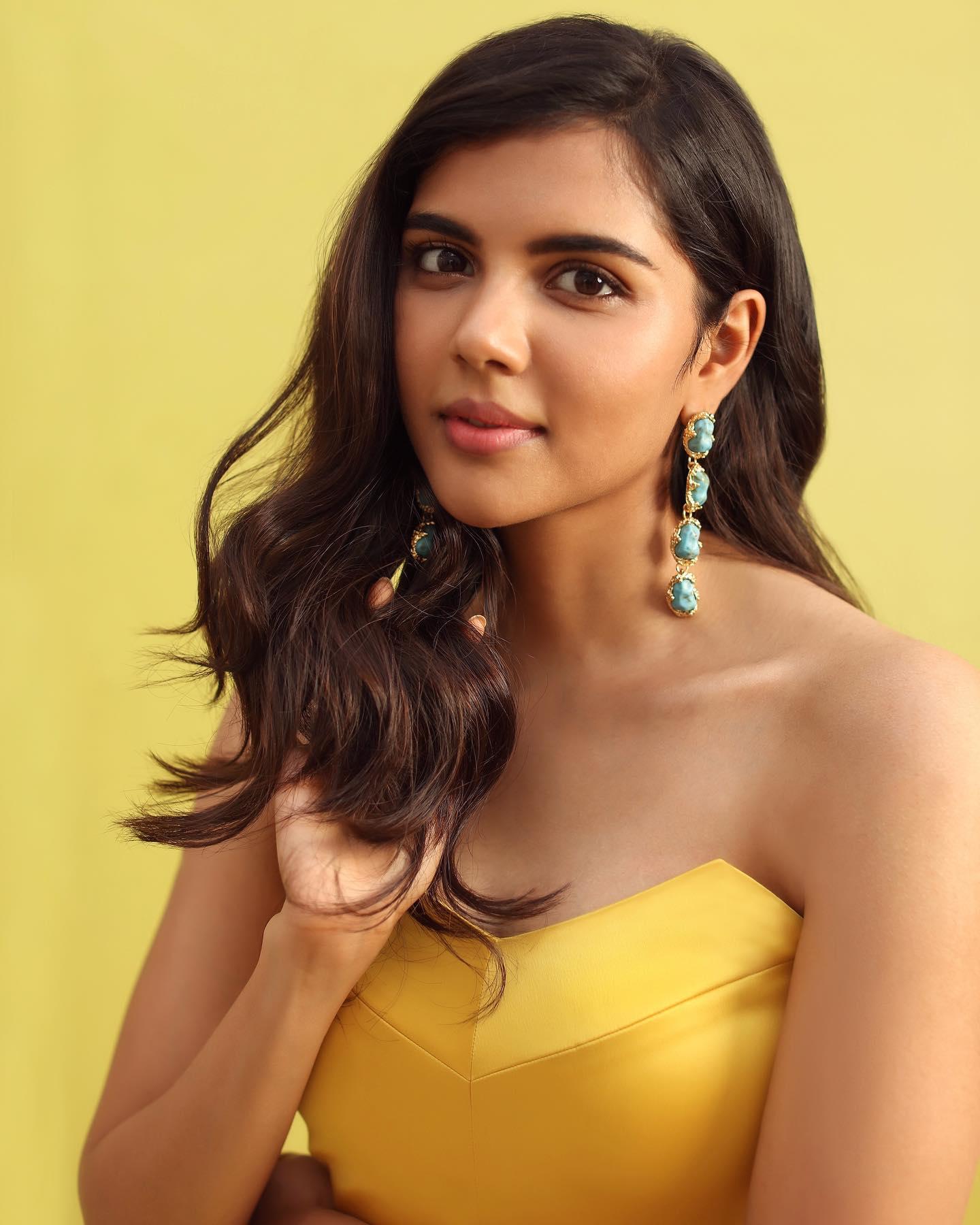 Priyadarshan in Yellow Dress with Blue Earrings Photo
