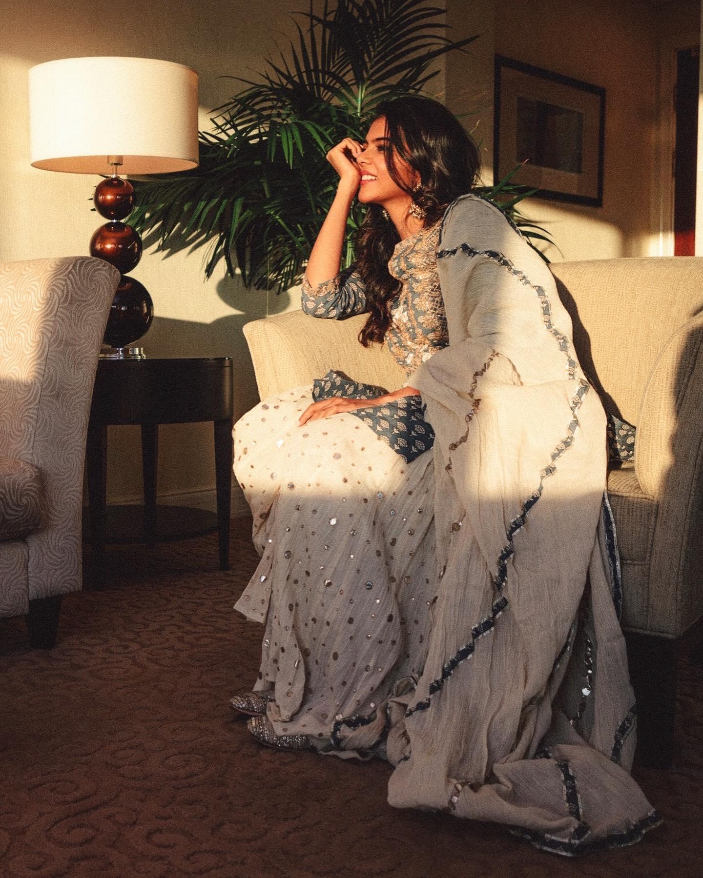 Priyadarshan Watching Sunset in Blue and Gray Dress Image