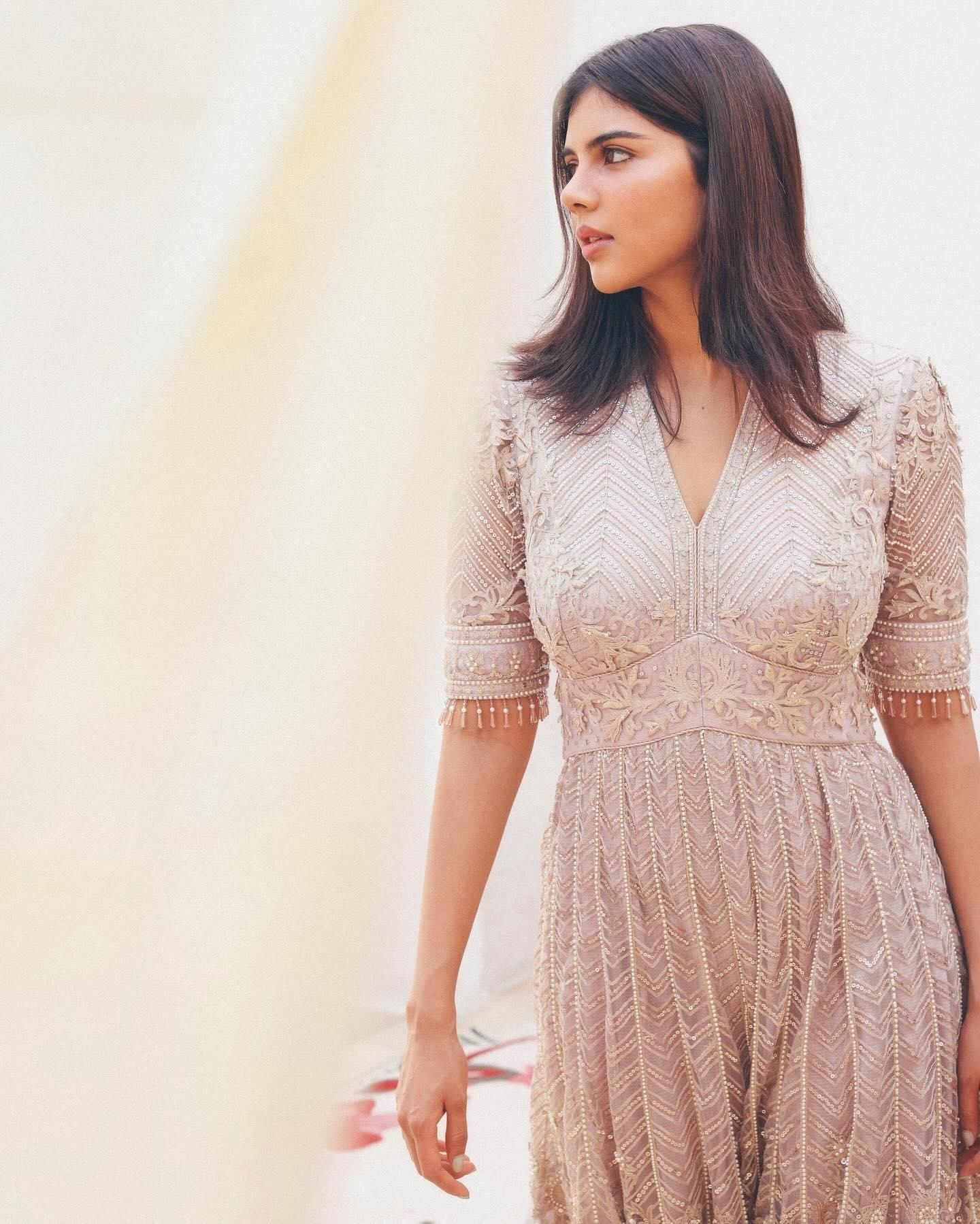 Priyadarshan Wearing a Peach Colored Dress free Image