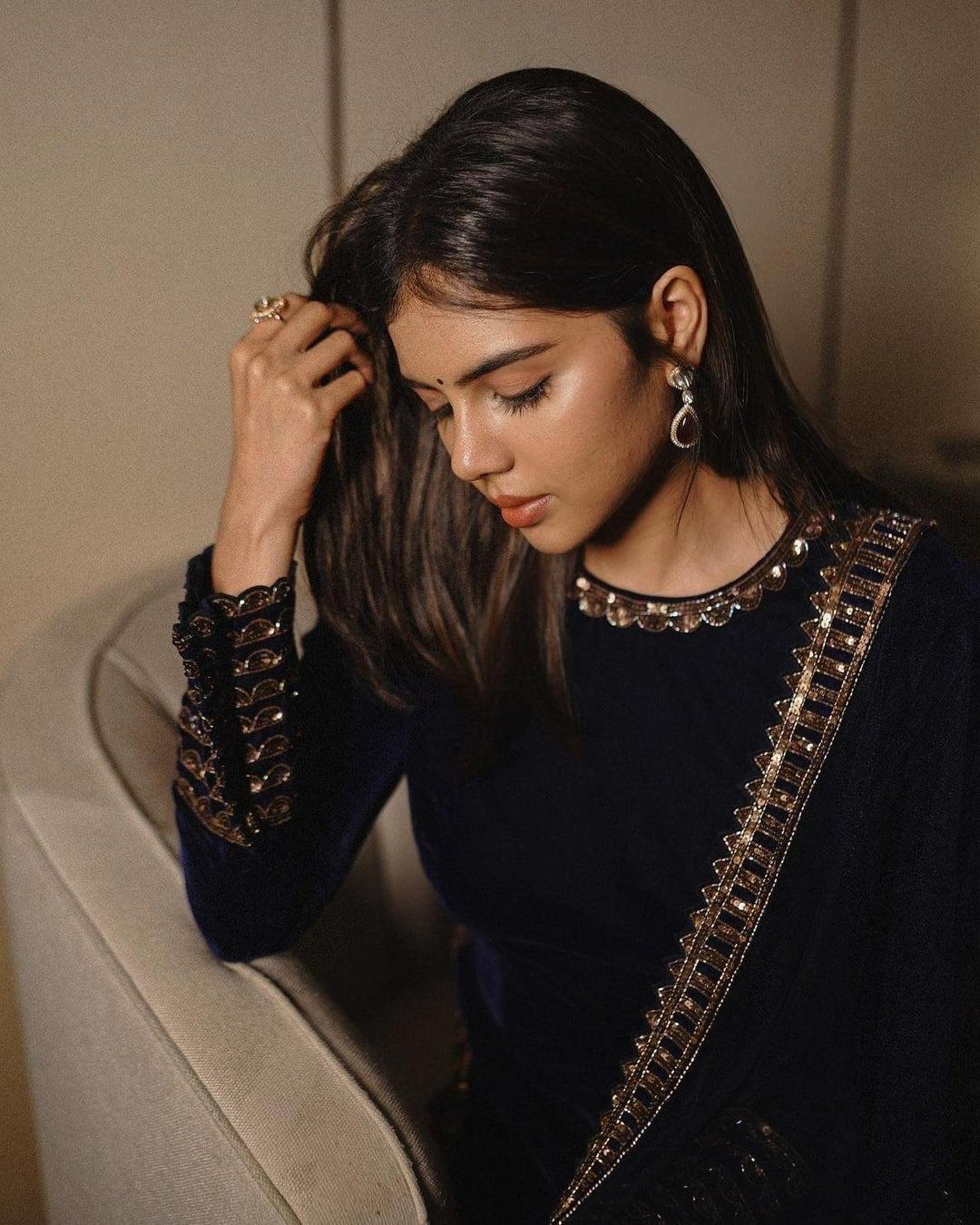 Priyadarshan Wearing Black Dress and Black Earrings Image