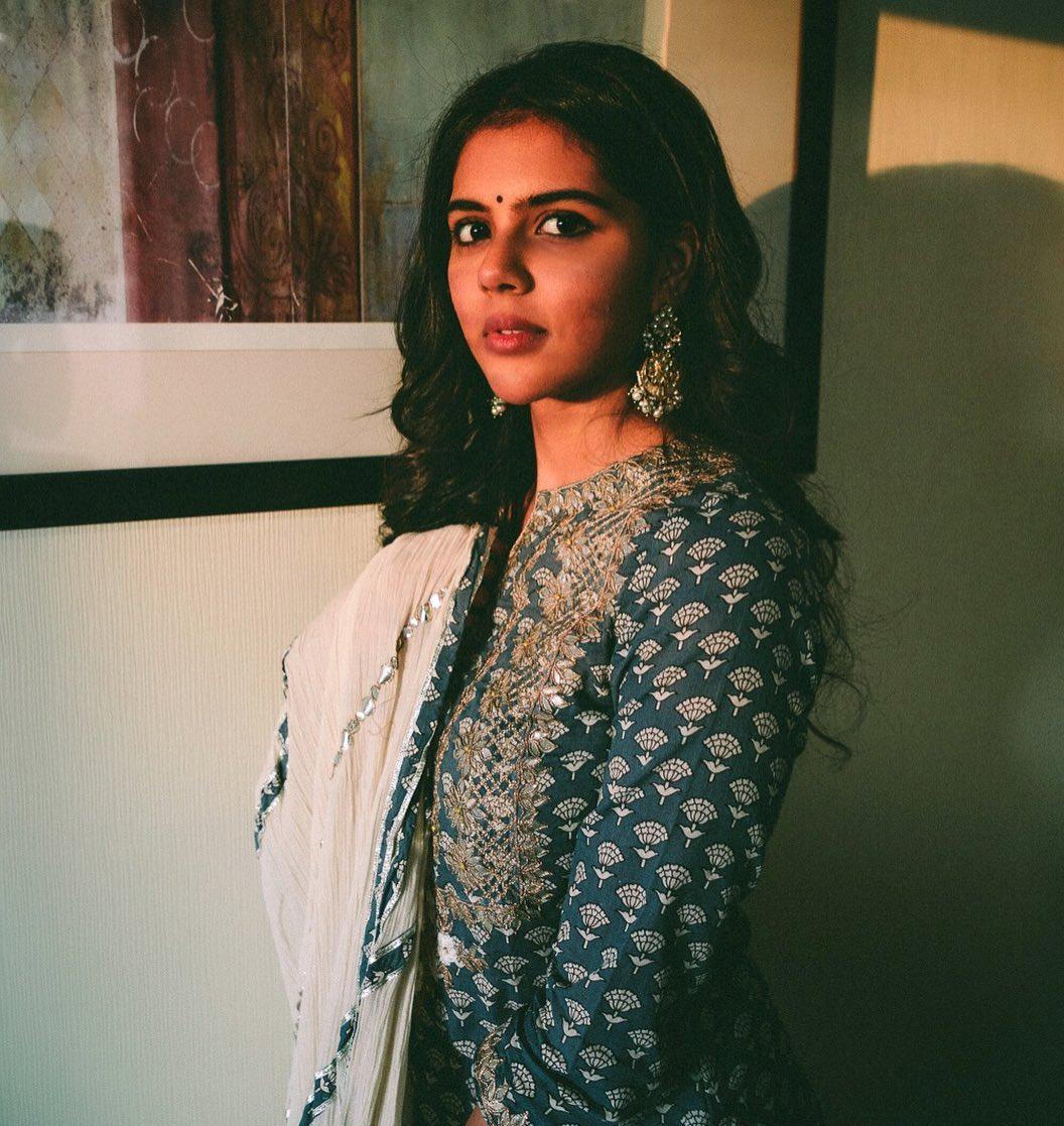 Priyadarshan Wearing Blue and White Dress Wallpaper