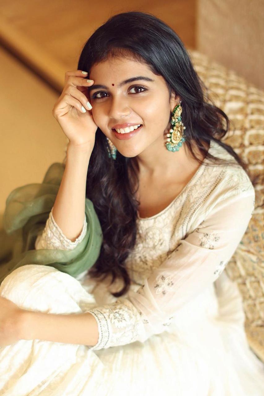 Priyadarshan Wearing White Top with Green Earrings Image