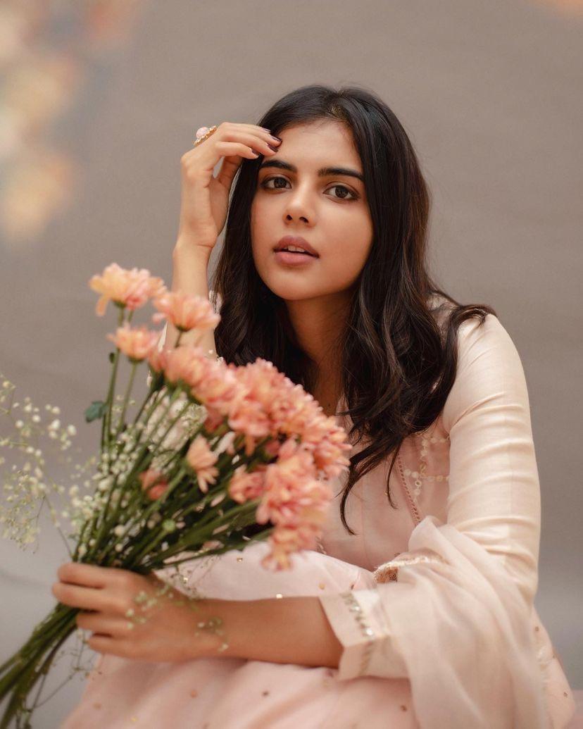 Priyadharshan Holding Peach Flowers in Pastel Dress Pic