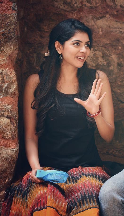 Smiling Kalyani in Black Top Talking in Casual Setting Image